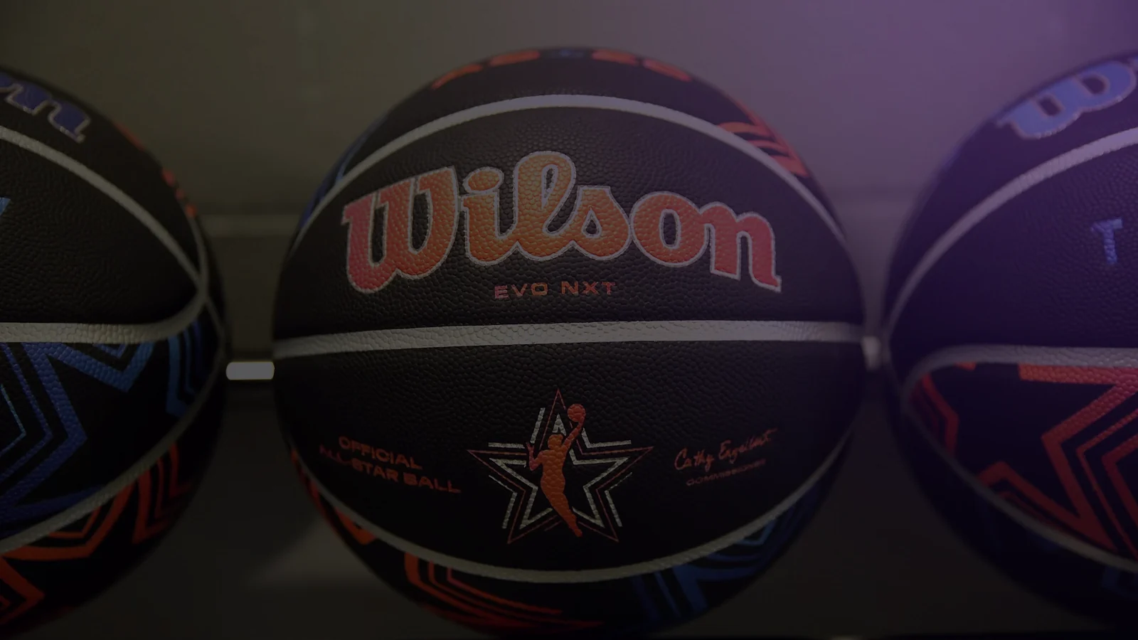 Photo: official WNBA All-Star game basketballs on a rack.